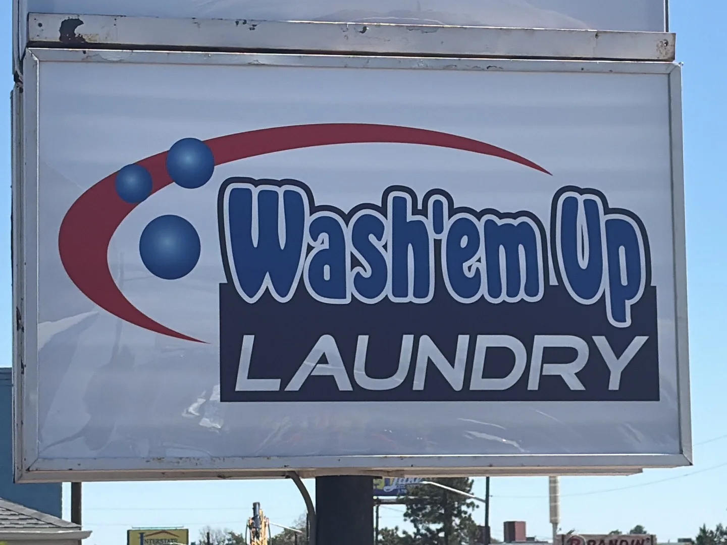 Wash'em Up Laundry roadside sign on East Colfax Avenue