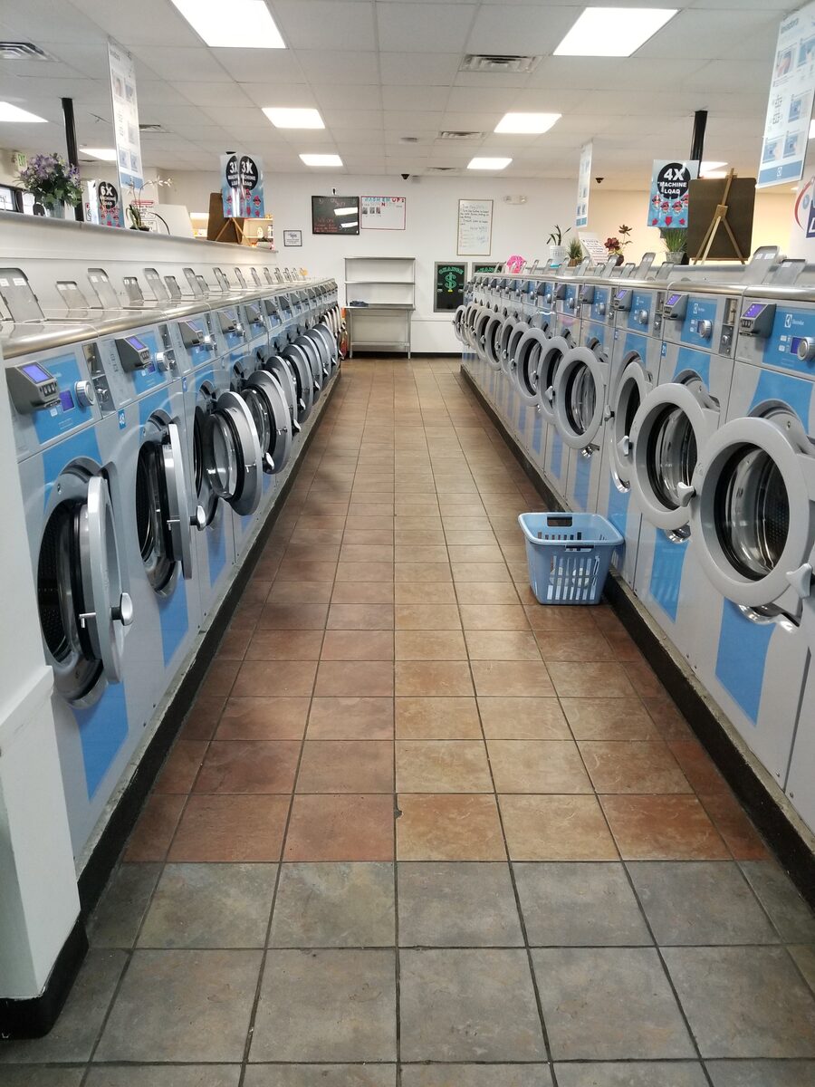 Rows of laundry machines inside Wash'em Up Laundry #2 - Laundromat Denver